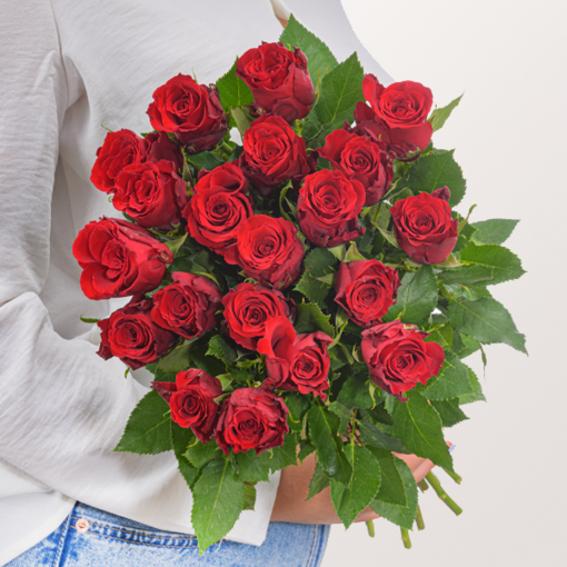 Red Fairtrade roses in a bunch with vase