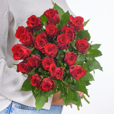 Red Fairtrade roses in a bunch with vase